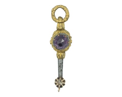 Lot 431 - A 19th-century gold-plated purple paste set watch key, the winding end later set with a diamond.