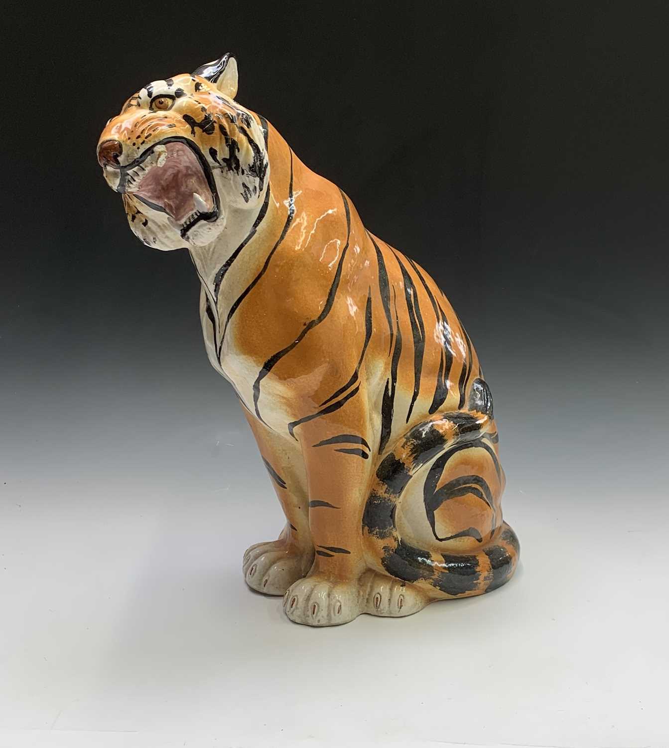 Lot 926 - A large ceramic model of a seated tiger....