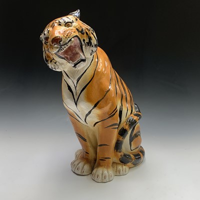 Lot 926 - A large ceramic model of a seated tiger....