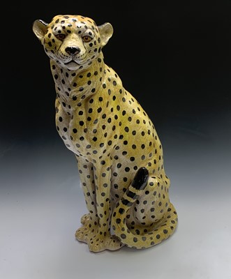 Lot 874 - A large ceramic model of a seated leopard....