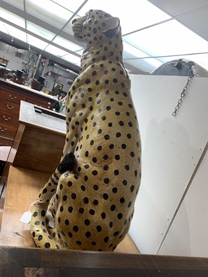 Lot 874 - A large ceramic model of a seated leopard....