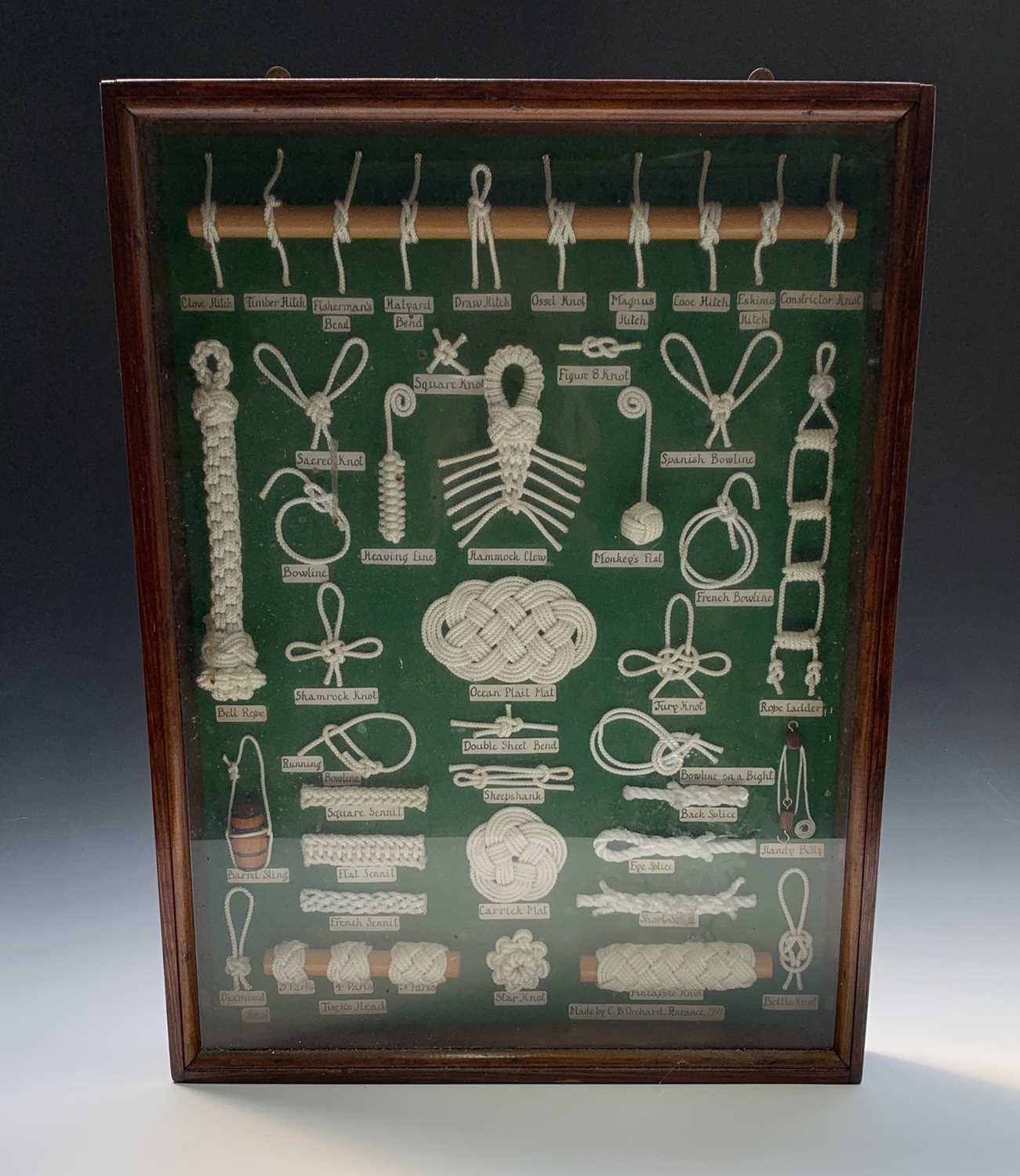 Lot 26 - A knot board displaying an arrangement of 42...