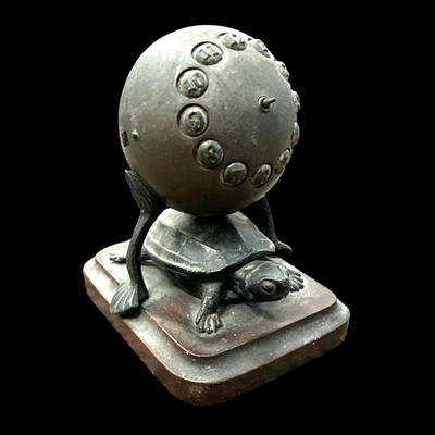 Lot 40 - An antique German-made clock sitting on a...