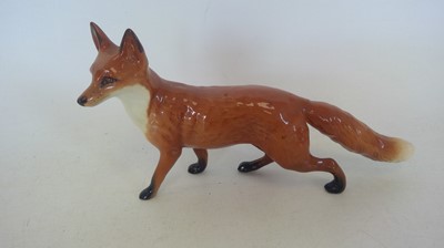 Lot 14 - A Large Beswick Fox. 14cm tall and 24cm long.