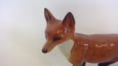 Lot 14 - A Large Beswick Fox. 14cm tall and 24cm long.