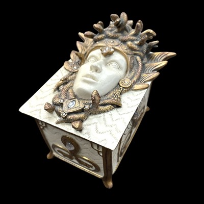 Lot 41 - A resin jewellery casket featuring the head of...