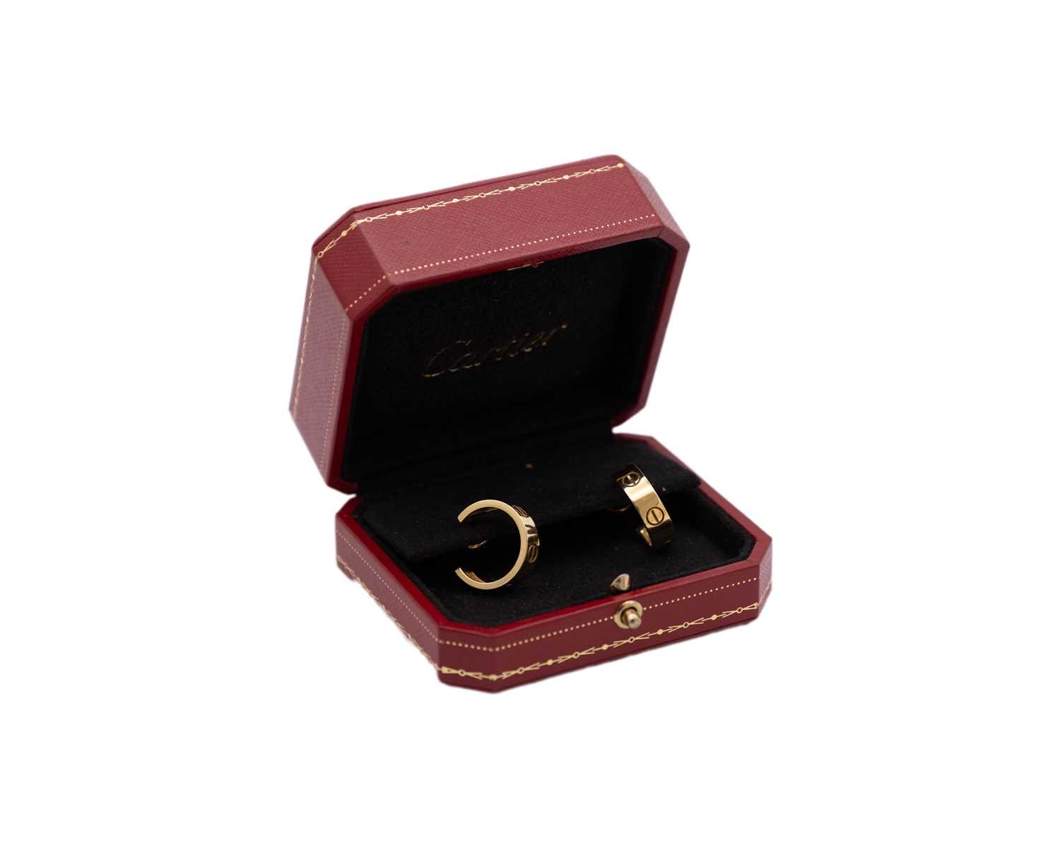 Lot CARTIER - A pair of 18k 'LOVE' hoop earrings, within original box.