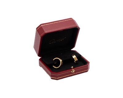 Lot CARTIER - A pair of 18k 'LOVE' hoop earrings, within original box.