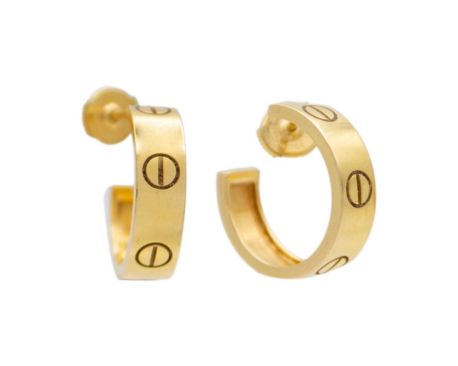 Lot 10 - CARTIER - A pair of 18k 'LOVE' hoop earrings, within original box.