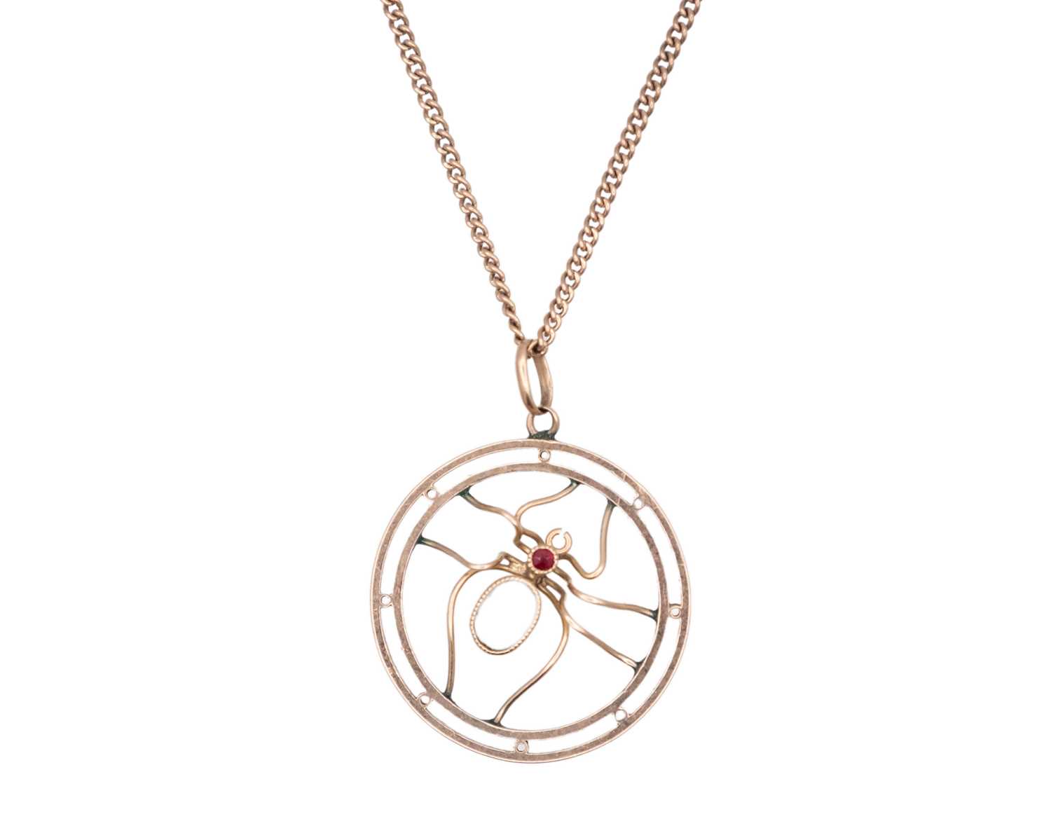 Lot 27 - A 9k rose gold spider pendant, set with rubies and pale blue paste, on a 9k neck chain.