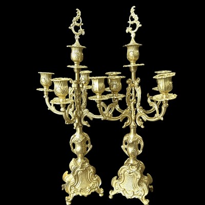 Lot 27 - A pair of gilt-brass Rococo style five-arm...