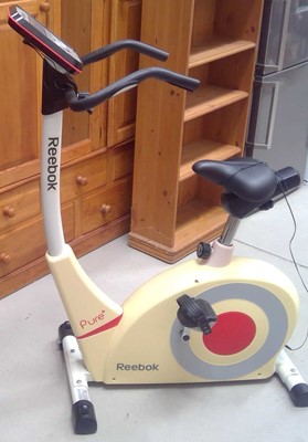Lot 36 - A Reebok Pure+ Exercise Cycle. The Cycle and...