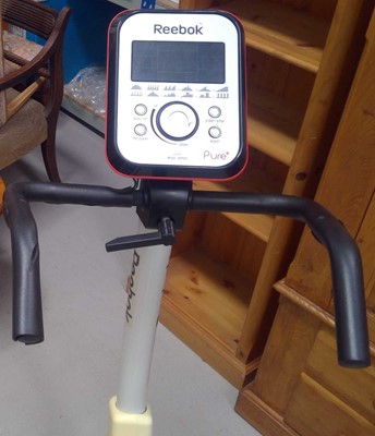 Lot 36 - A Reebok Pure+ Exercise Cycle. The Cycle and...