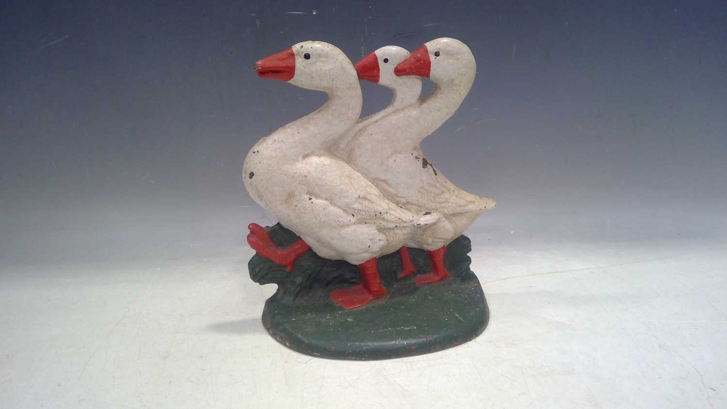 Lot 29 - A Cast Iron Doorstop in the Shape of Three...