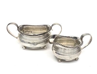 Lot 2015 - A Georgian silver cream jug and sugar bowl by...