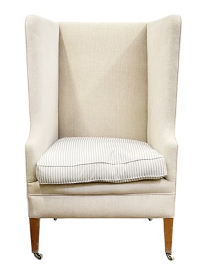 Lot 809 - An Edwardian deep wing back armchair.