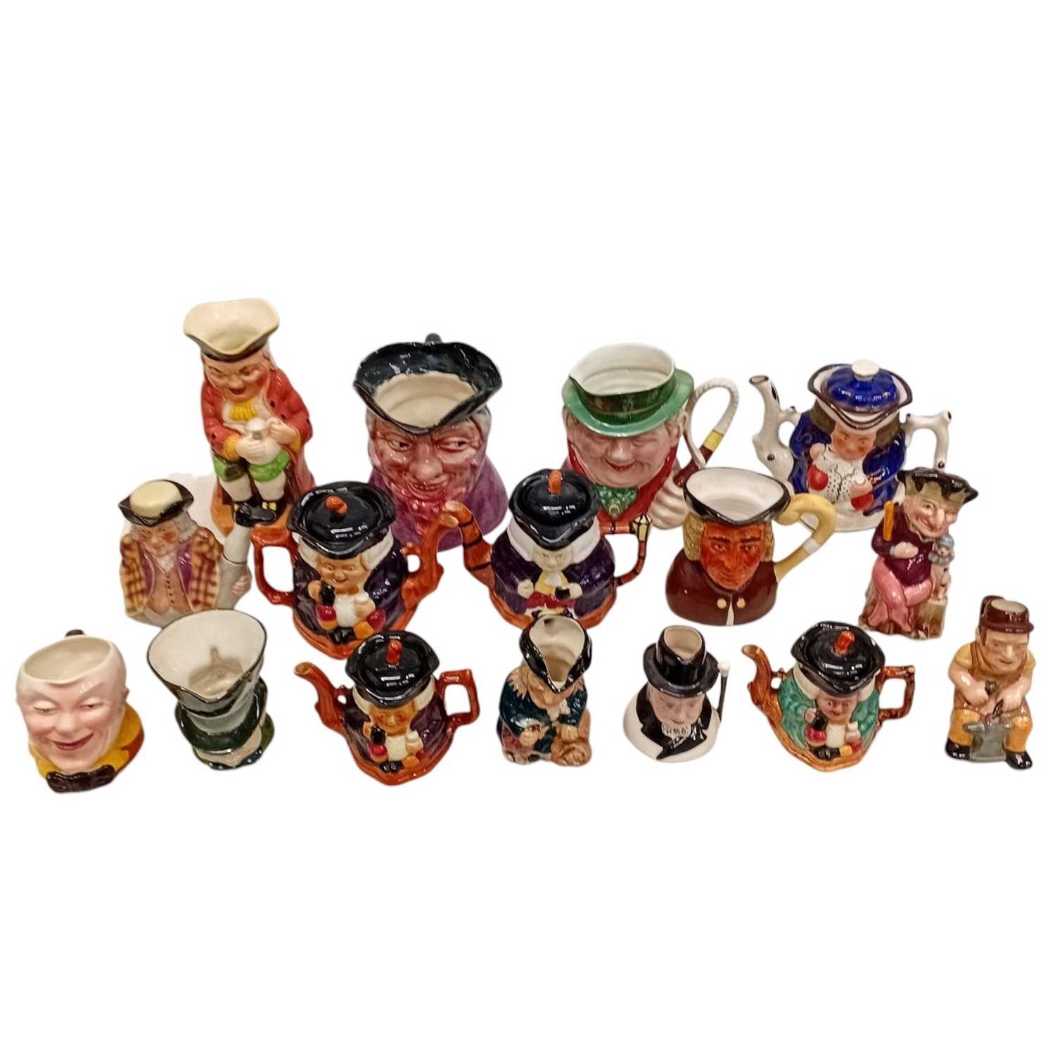 Lot 44 - A collection of Toby jugs & Teapots, including...