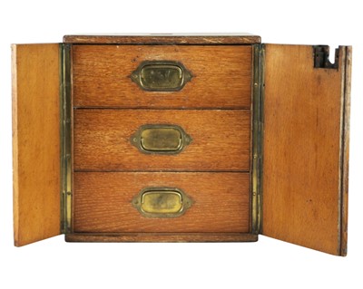 Lot 50 - A late Victorian oak humidor or collector's cabinet.