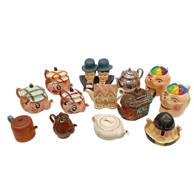 Lot 148 - A collection of character teapots and a Laurel...