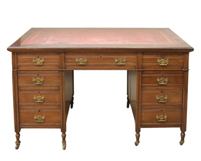 Lot 801 - An Edwardian walnut kneehole writing desk.