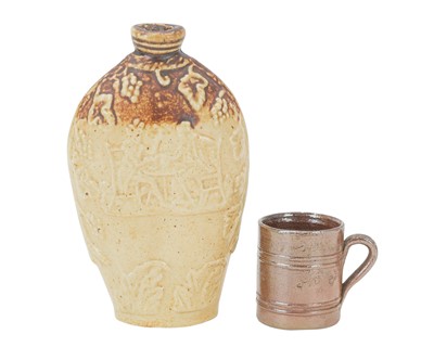 Lot 616 - A brown salt-glazed small flask.