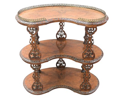 Lot 882 - A Victorian figured walnut three tier kidney shape etagere.