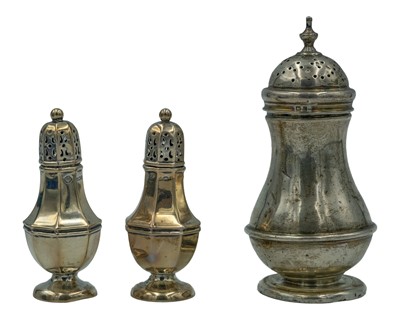 Lot 114 - A pair of silver sugar casters by William Hutton & Sons Ltd.