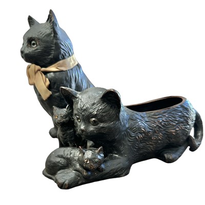 Lot 205 - Two Bretby pottery black cats, the seated one...