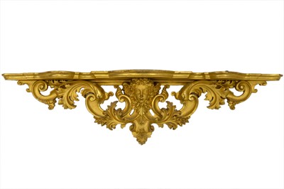 Lot 812 - An ornate carved giltwood wall bracket.
