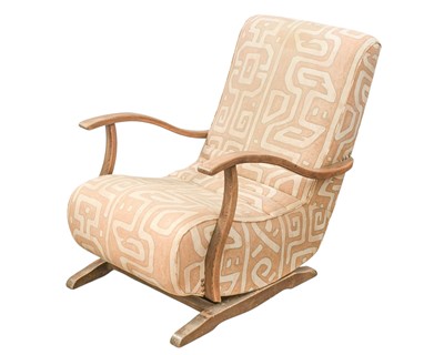 Lot 274 - A mid-century beech framed rocking armchair.