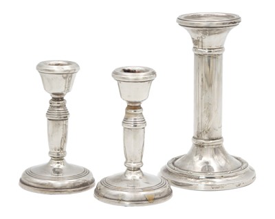 Lot 252 - A pair of silver candlesticks by W. I. Broadway & Co.