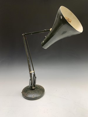 Lot 253 - A green painted anglepoise style lamp on...