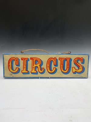 Lot 273 - A sign written wooden sign 'Circus'. 19 x 66cm.