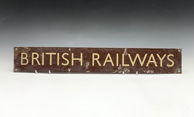 Lot 256 - Railwayana - A brown enamel sign with cream...