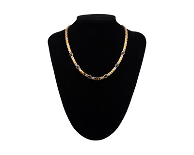 Lot 29 - An attractive modern 18k yellow and white gold diamond and sapphire set demi-parure.