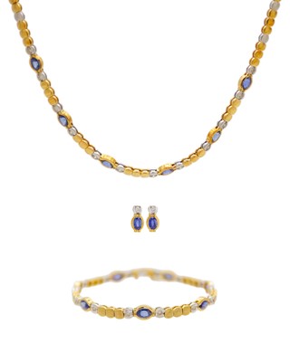 Lot 29 - An attractive modern 18k yellow and white gold diamond and sapphire set demi-parure.