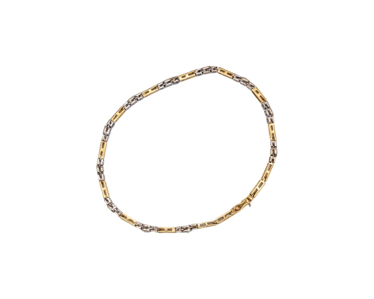 Lot 63 - A modern 18k white and yellow gold diamond set bracelet.