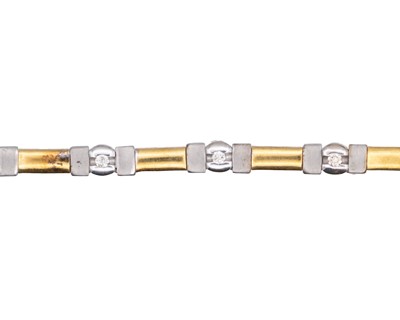 Lot 63 - A modern 18k white and yellow gold diamond set bracelet.