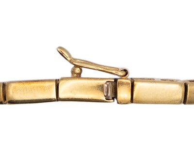 Lot 63 - A modern 18k white and yellow gold diamond set bracelet.