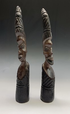 Lot 245 - A pair of African carved wood heads. Height 39cm.