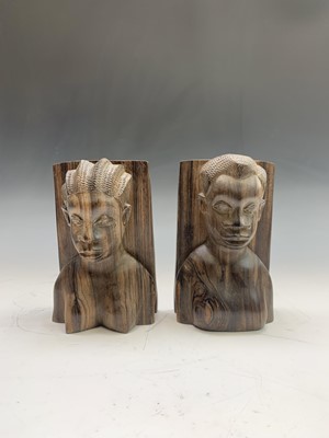 Lot 150 - A pair of African carved wood bookends, each...