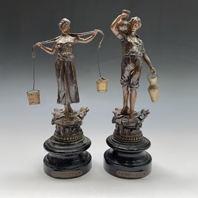 Lot 324 - A pair of spelter figures modelled as water...