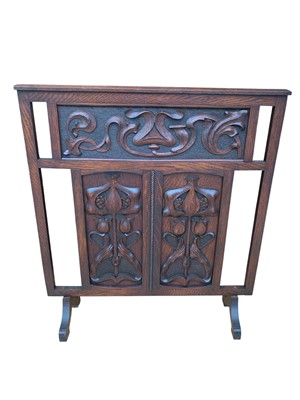 Lot 219 - An oak arts and crafts fire screen.