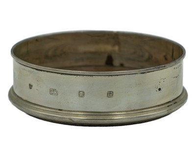 Lot 340 - A silver wine coaster by David Richards & Sons.