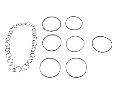 Lot 449 - A selection of seven silver white metal bangles, and a contemporary silver circular link neck chain.