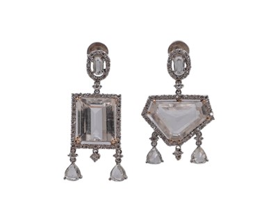 Lot A fine pair of 18k (tested) white gold, white zircon and diamond set cluster drop earrings.