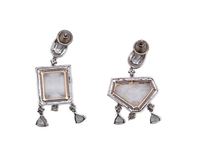 Lot A fine pair of 18k (tested) white gold, white zircon and diamond set cluster drop earrings.