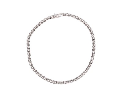 Lot 83 - A good 18k white gold diamond line bracelet.