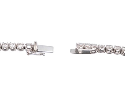 Lot 83 - A good 18k white gold diamond line bracelet.
