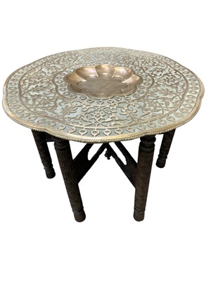 Lot 330 - An Anglo Indian brass top folding table.